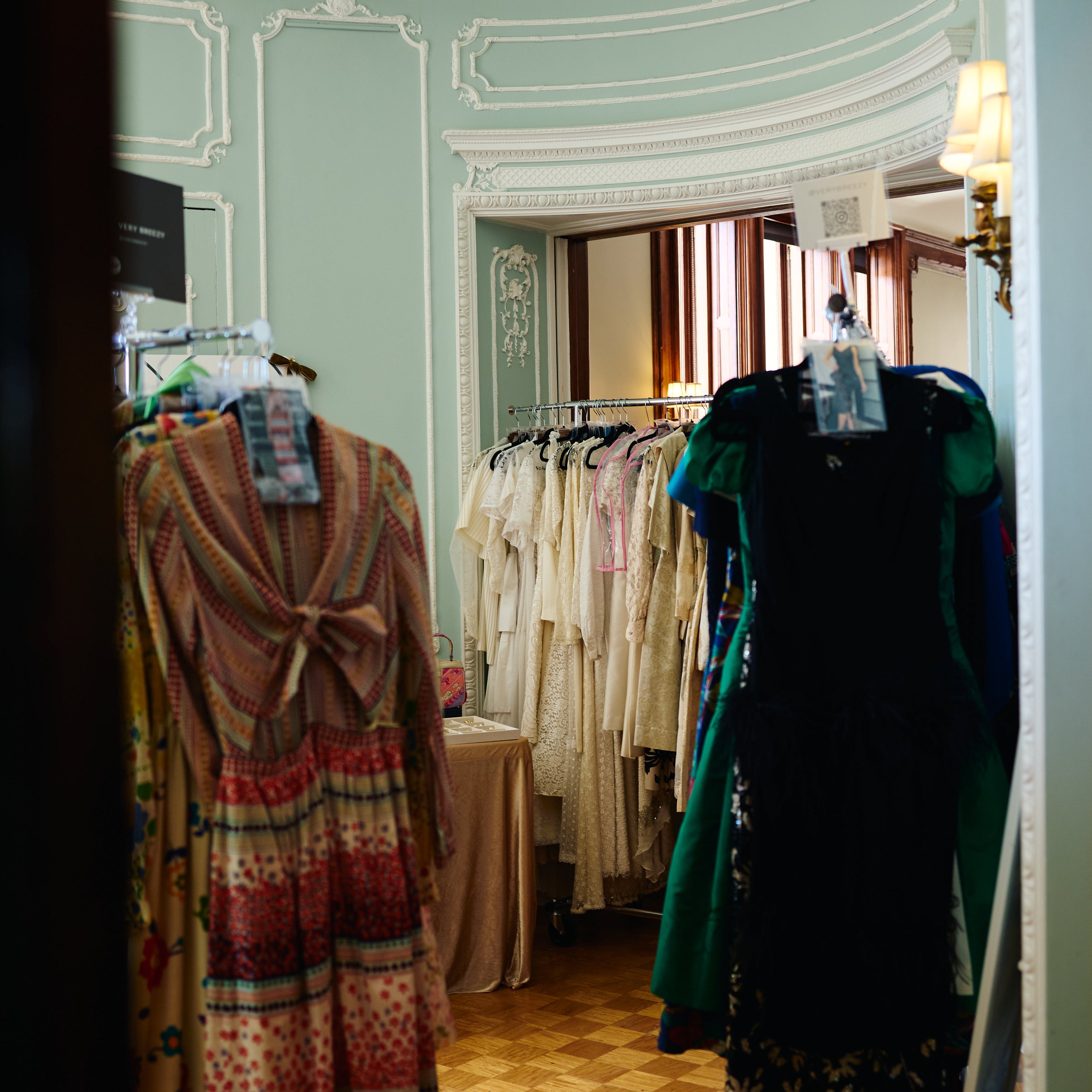 Vintage dresses hanging on racks in a one-day-only Manhattan Vintage event on the Upper East Side inside the Ukrainian Institute