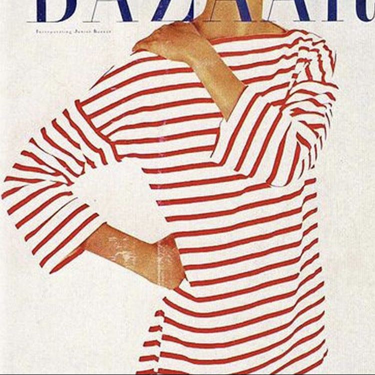 Harper's Bazaar magazine cover with a woman wearing a red and white striped dress.